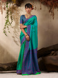 Turquoise Kanjivaram silk blend saree with intricate golden woven border.