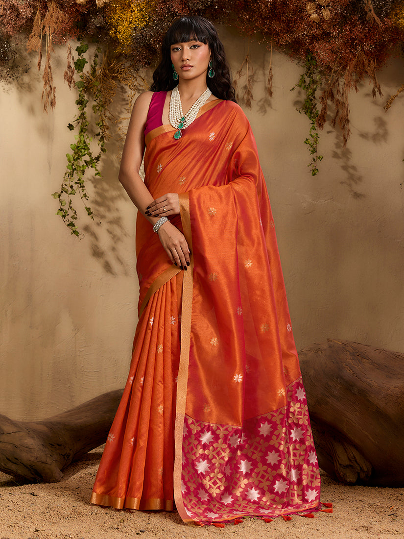 Vibrant orange Tussar silk blend saree with intricate woven patterns.