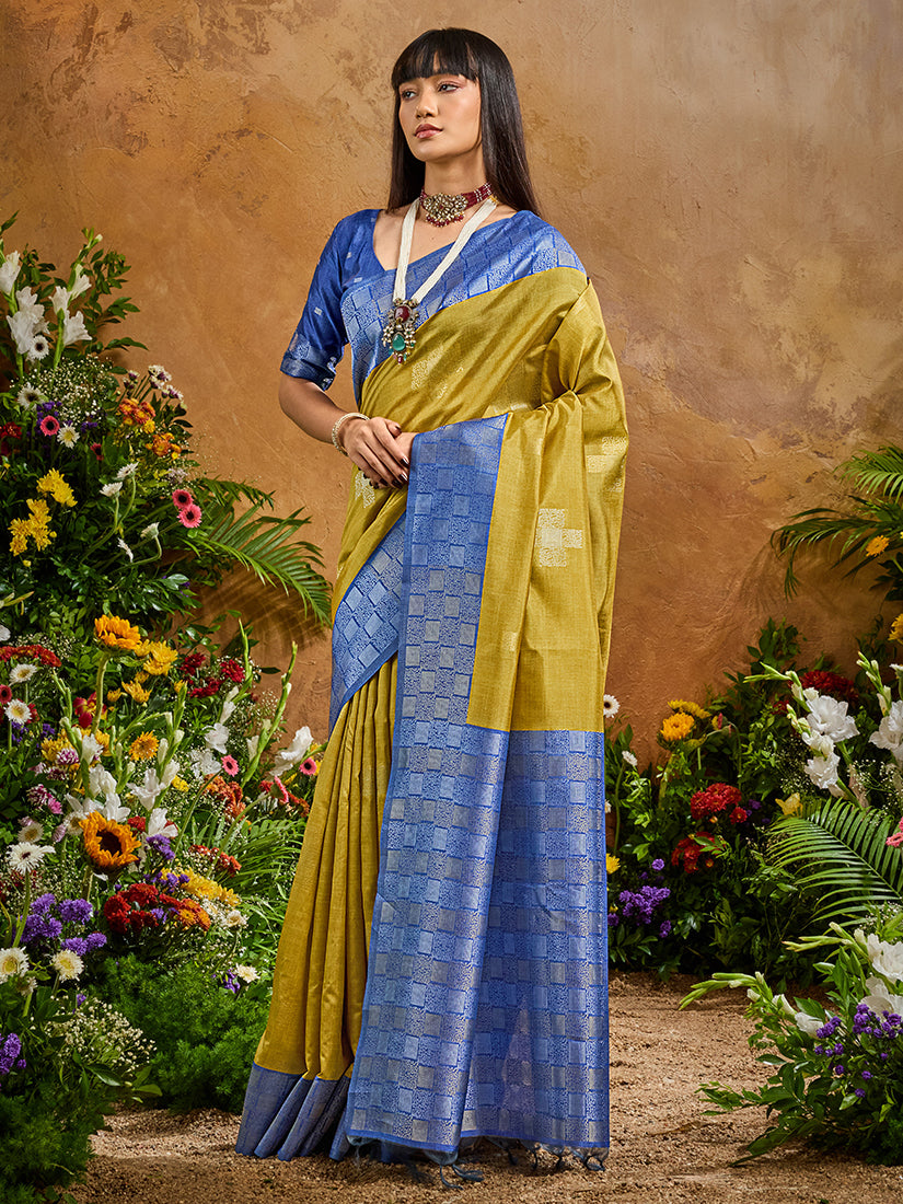 Mustard yellow silk blend saree with traditional woven work and elegant drape.