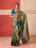 Elegant green silk blend saree with intricate woven traditional patterns