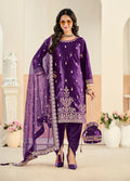 Luxurious purple velvet salwar kameez with intricate embroidery and sequins work