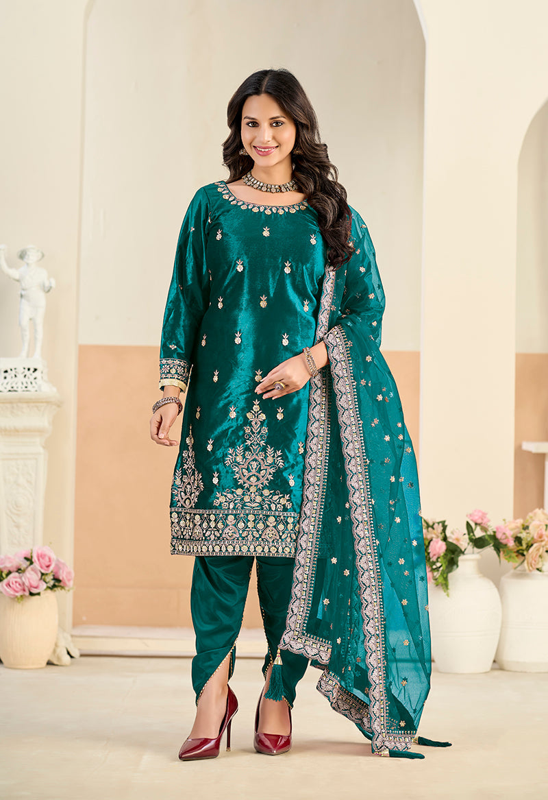 Teal velvet salwar kameez featuring intricate embroidery and sequins work