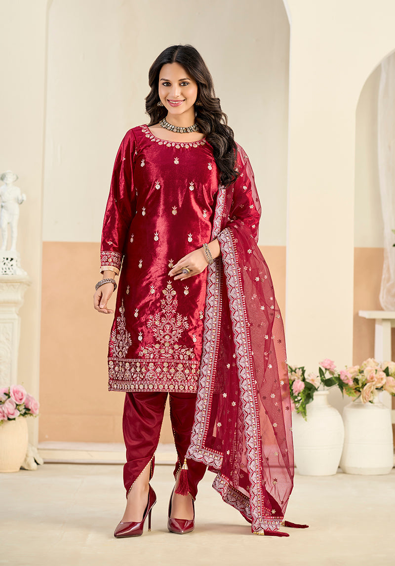 Maroon velvet patiala salwar kameez with detailed embroidery and sequins.