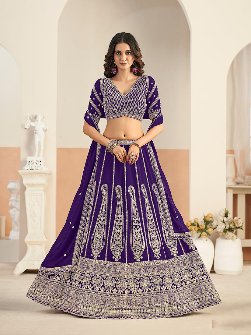Woman wearing a purple faux georgette lehenga choli with intricate embroidery and sequin detailing