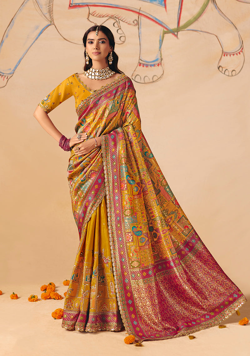 Mustard silk blend saree featuring traditional cutwork, lace borders, and intricate embroidery