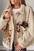 A woman wearing a cozy beige and brown leopard print sherpa jacket with a collared neck and functional pockets.
