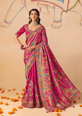 Rani pink silk blend saree featuring intricate embroidery, cutwork, and lace detailing with matching blouse.