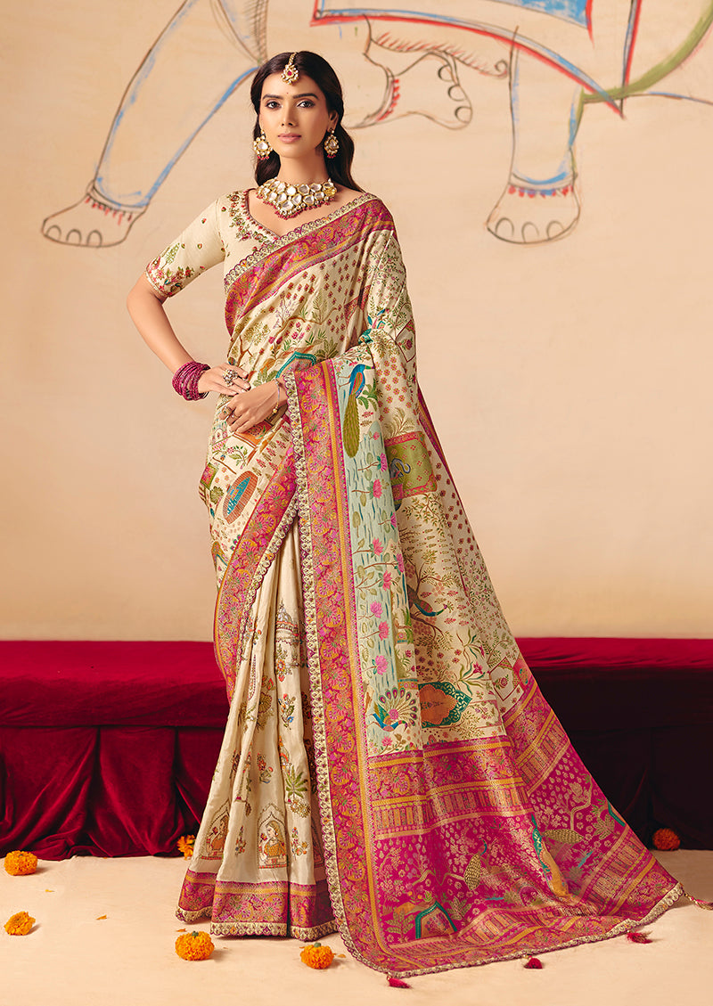 Cream embroidered silk blend saree with lace and cutwork details.