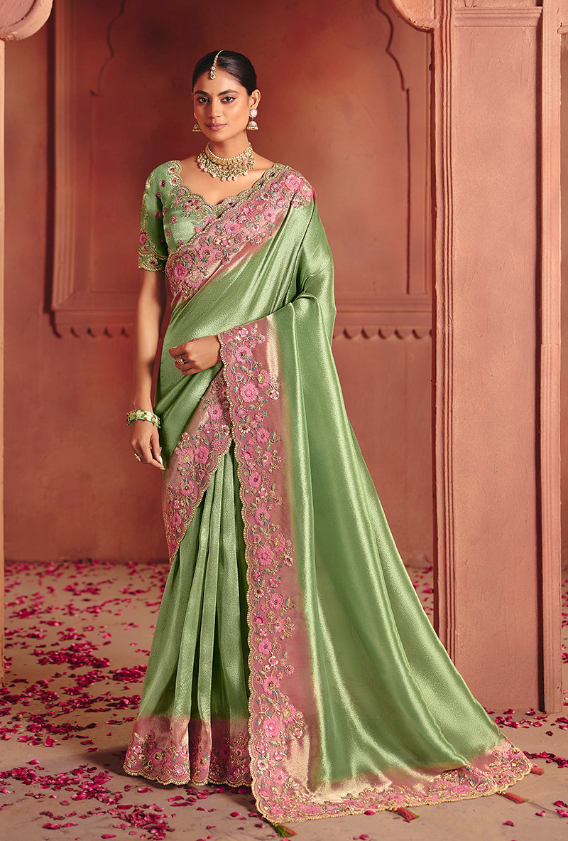 Sea green silk blend saree with detailed embroidery and sequin embellishments.
