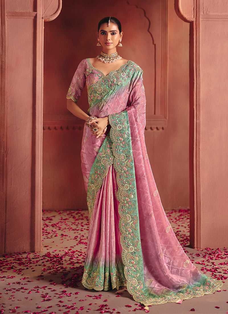 Elegant pink silk blend saree featuring detailed embroidery and sequin work.