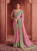 Elegant pink silk blend saree featuring detailed embroidery and sequin work.