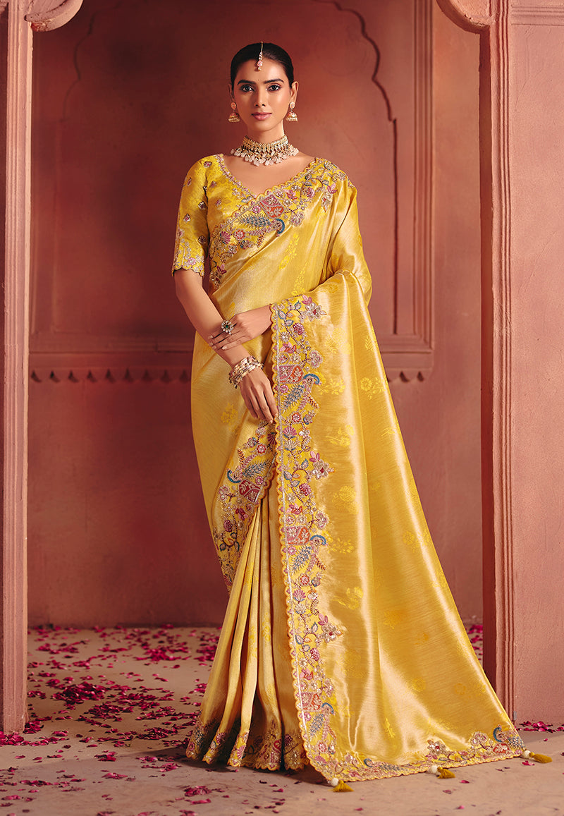 Yellow silk blend saree adorned with embroidery and sequins