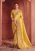 Yellow silk blend saree adorned with embroidery and sequins