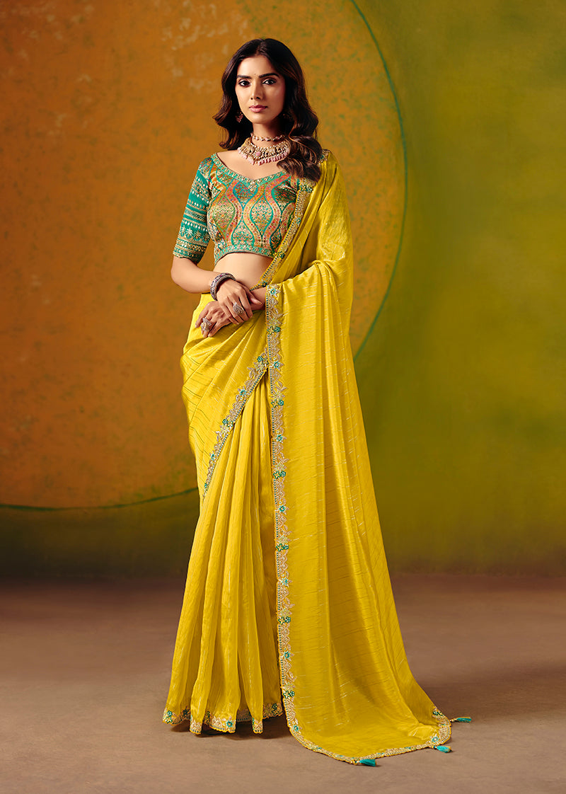 Vibrant yellow silk blend saree decorated with shimmering sequins and elegant thread work