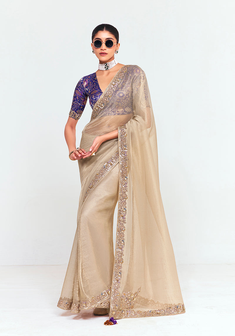 Beige fancy fabric saree with detailed embroidery and thread work