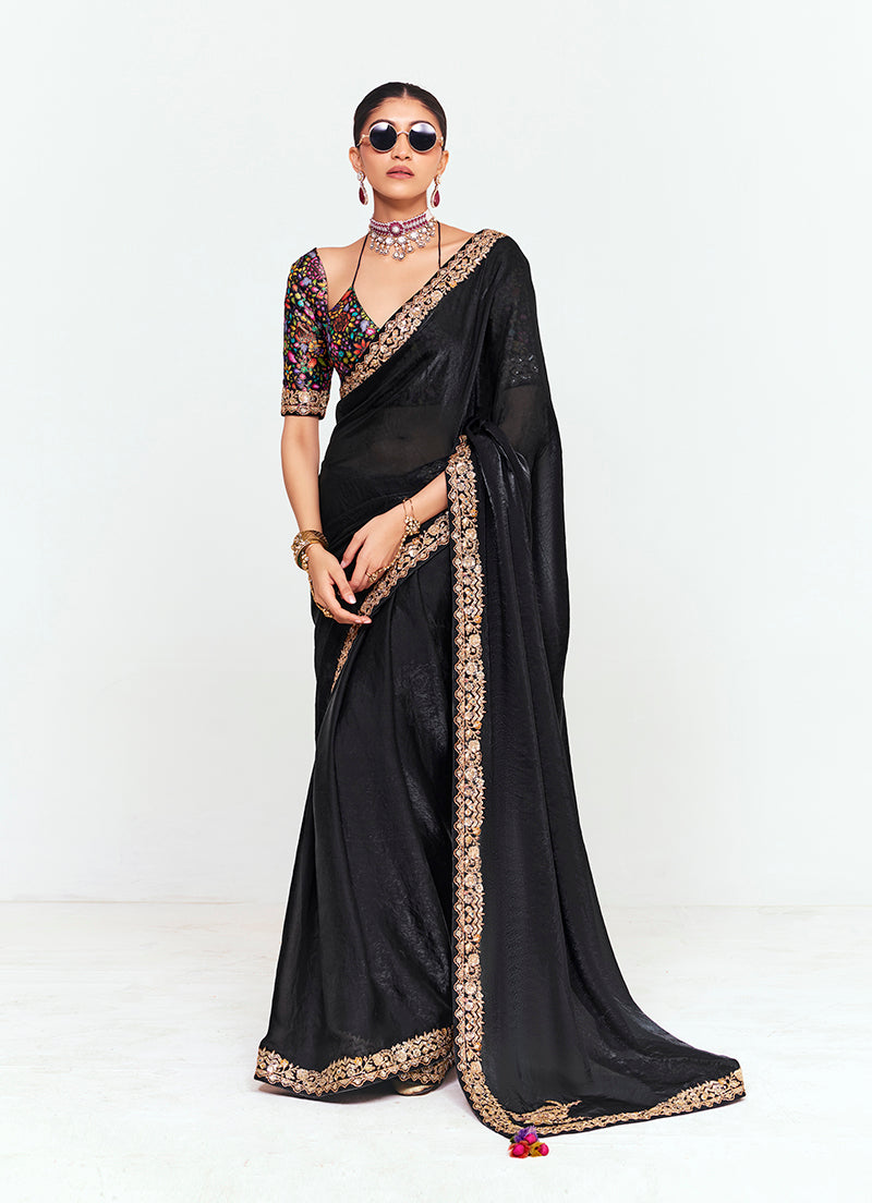 Black fancy fabric saree with intricate embroidery, sequins, and thread work borders