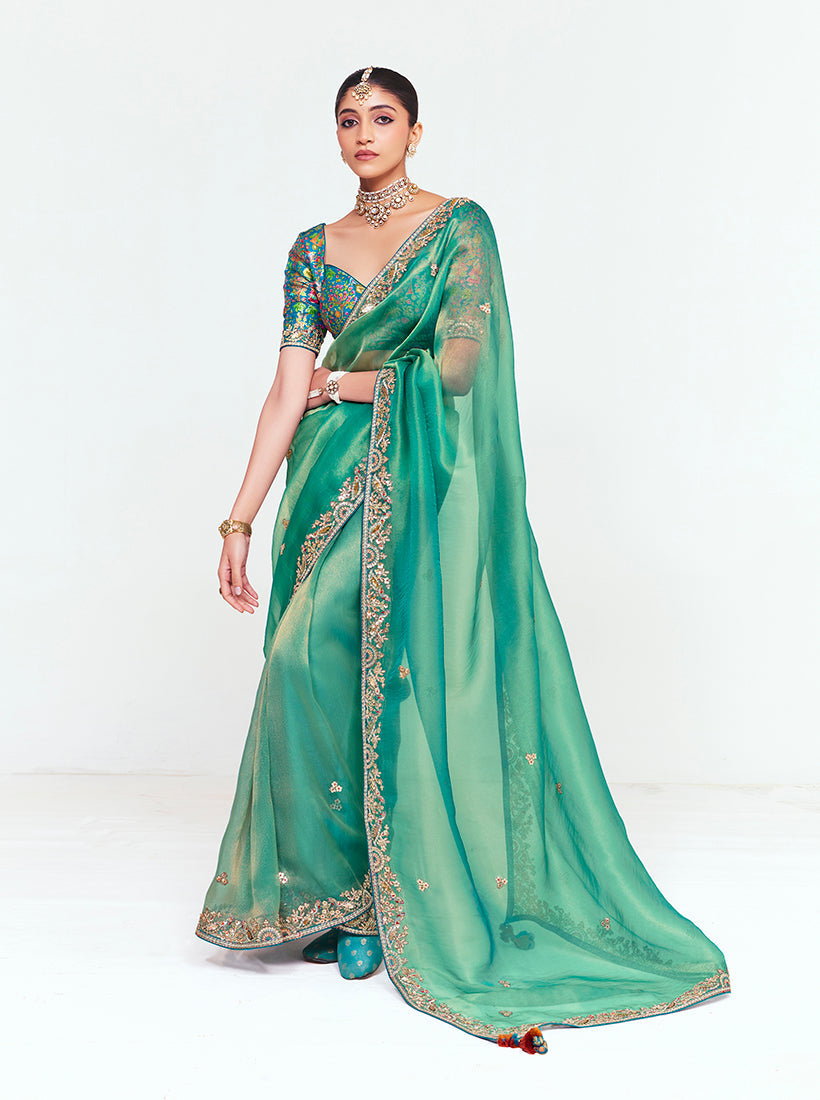 Sea Green fancy fabric saree with embroidered border and sequin detailing