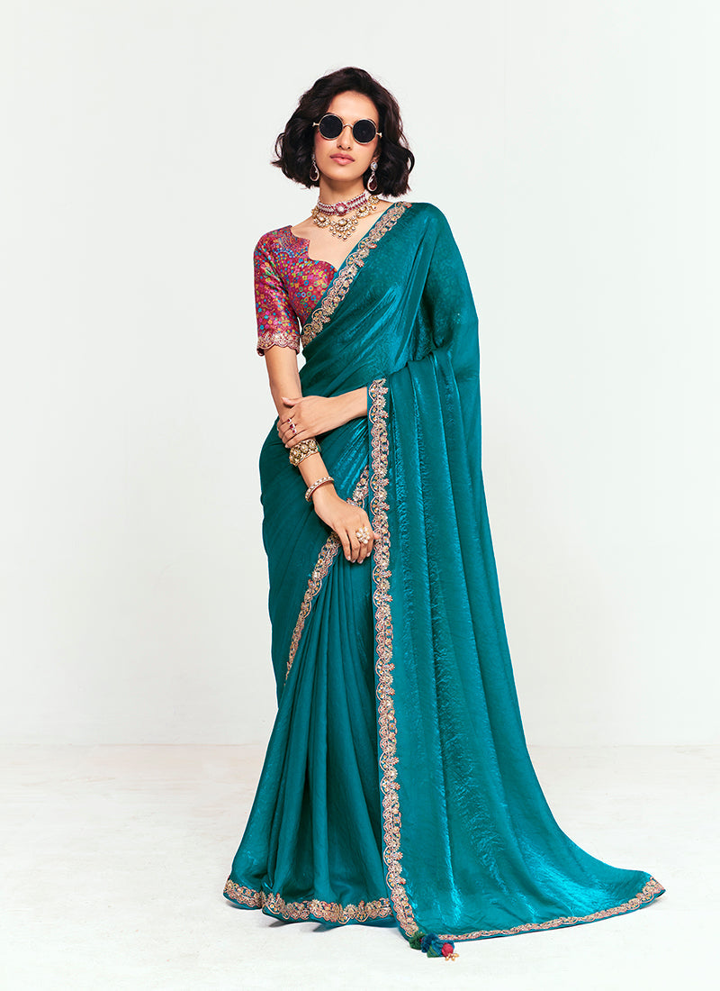 Teal fancy fabric saree featuring elegant sequins and thread work embroidery
