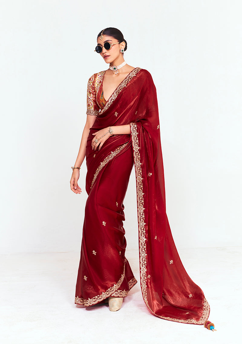 Maroon fancy fabric saree with embroidered border, thread work, and sequins
