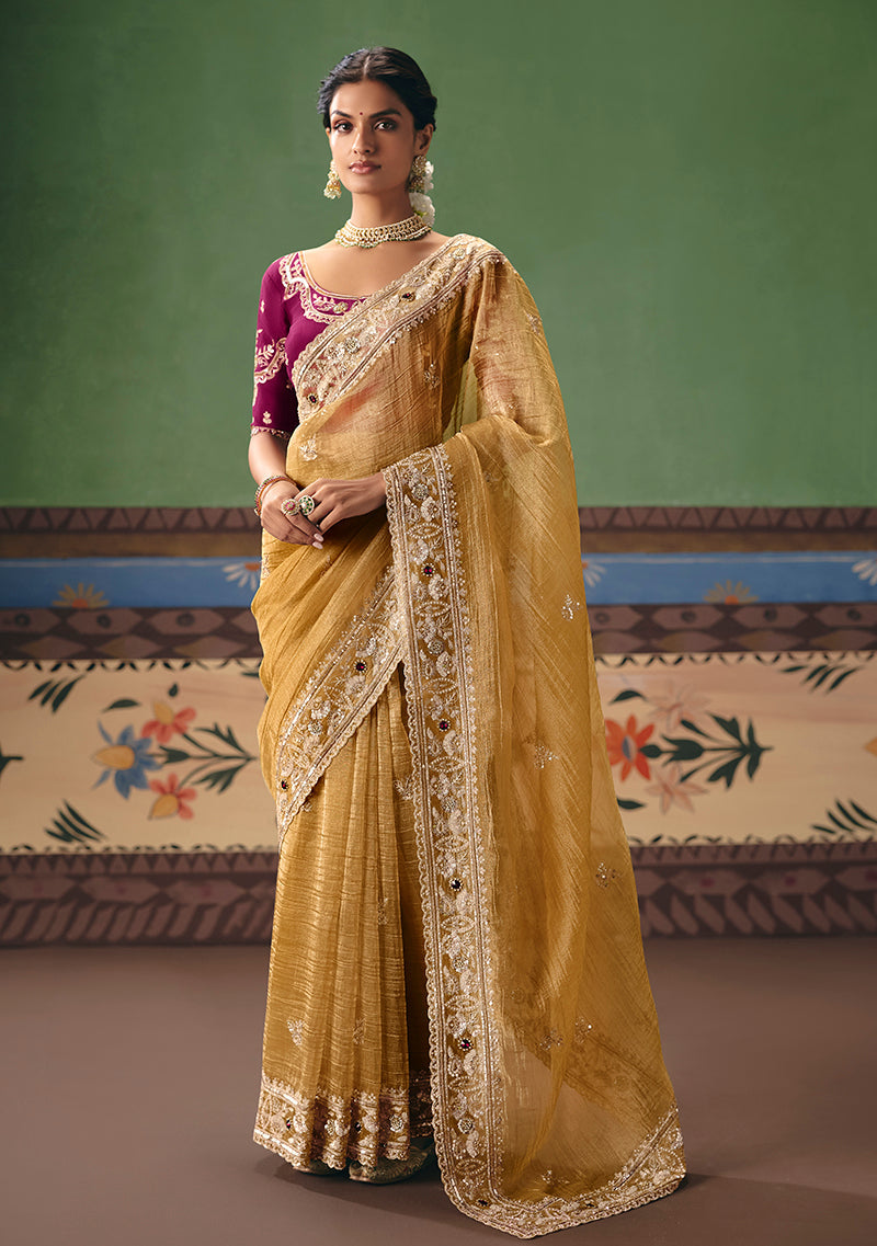 Vibrant mustard embroidered fancy fabric saree for festive occasions.