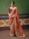 Coral fancy fabric saree with detailed embroidery
