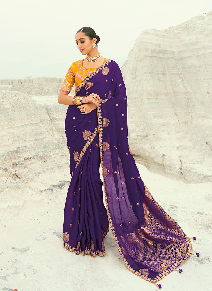 Elegant purple organza and satin saree with intricate embroidery detailing.