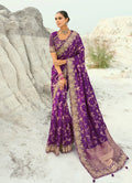 Dark magenta viscose saree featuring intricate cutdana, embroidered, and moti work with a matching blouse.