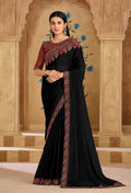 A black faux georgette saree with detailed embroidery and border work.