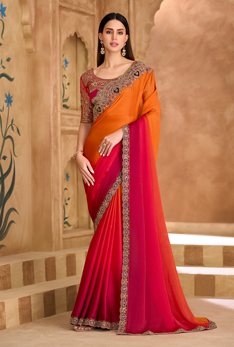 Orange and Rani Pink dual-tone faux chiffon satin saree with embroidery.