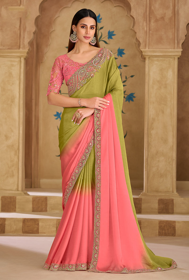 Parrot green and pink faux georgette saree with ethnic embroidered border.