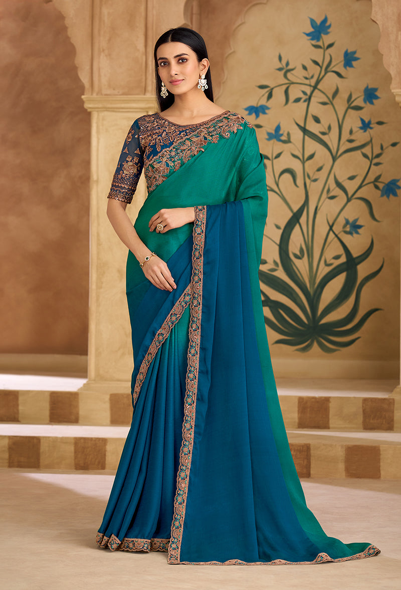 Teal green and blue faux chiffon saree with embroidered border