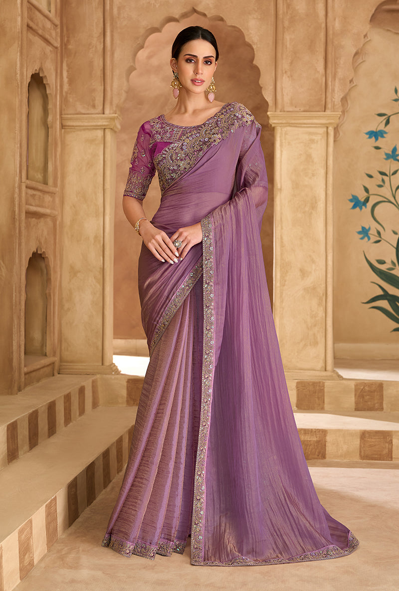 Sophisticated onion pink faux georgette and tissue saree with ethnic border