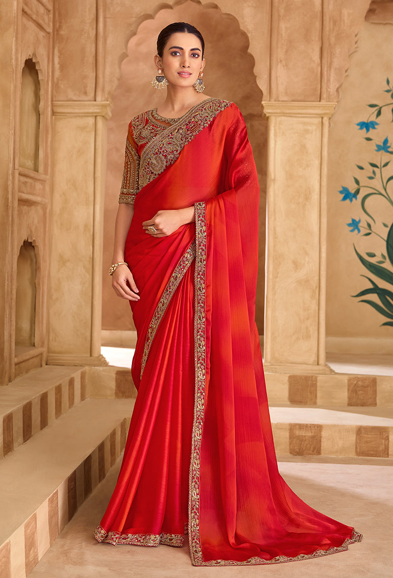 Shaded Red faux chiffon saree with embroidered border detail