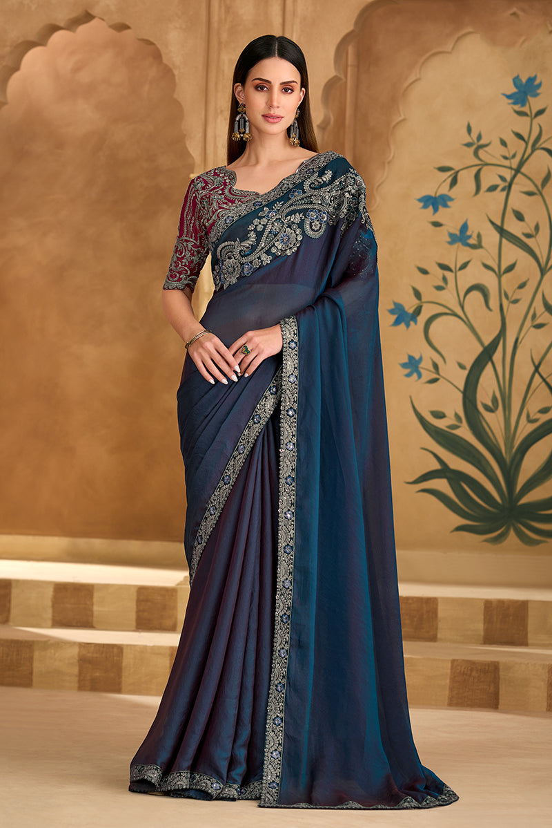Navy blue faux georgette saree with ethnic embroidery and border