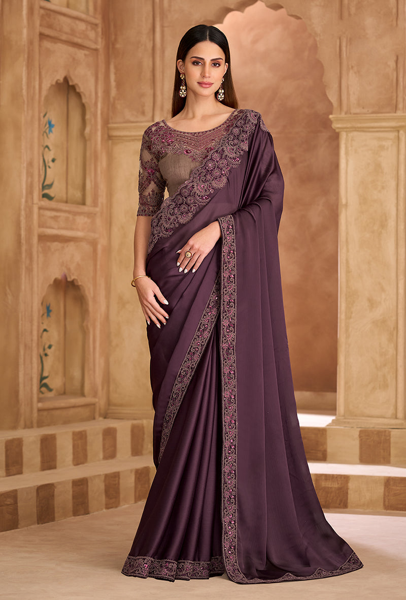 Wine-colored faux chiffon satin saree with elegant embroidered borders.