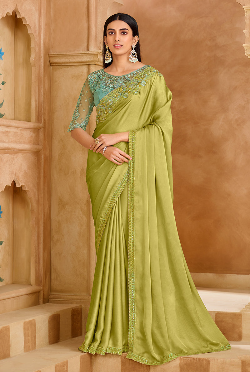 Light green faux chiffon satin saree with elegant embroidered borders.