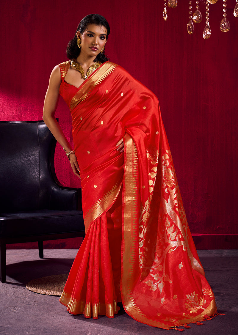 Red satin linen silk saree with woven gold motifs and temple border