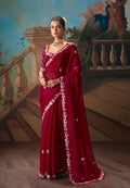 Elegant maroon fancy fabric saree with detailed embroidery