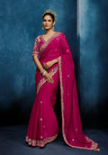 Rani pink embroidered fancy fabric saree with matching stitched blouse