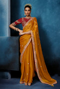 Bright orange embroidered saree with a matching stitched blouse