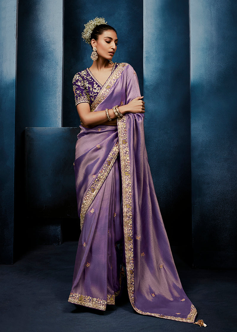 Lavender fancy fabric saree with embroidery and matching stitched blouse