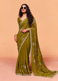 Olive green faux organza satin saree with detailed embroidery border.