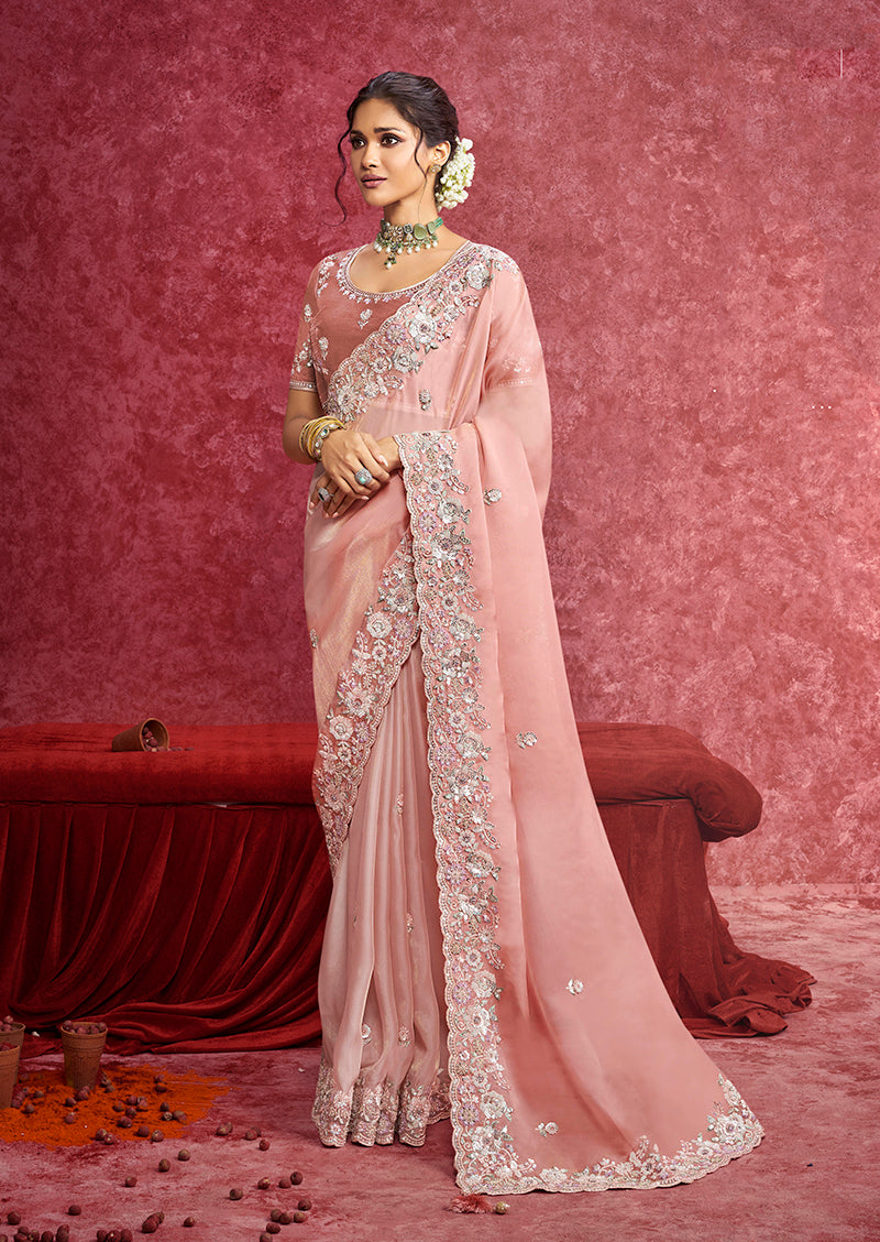 Peach satin silk saree with scalloped lace border and embroidery