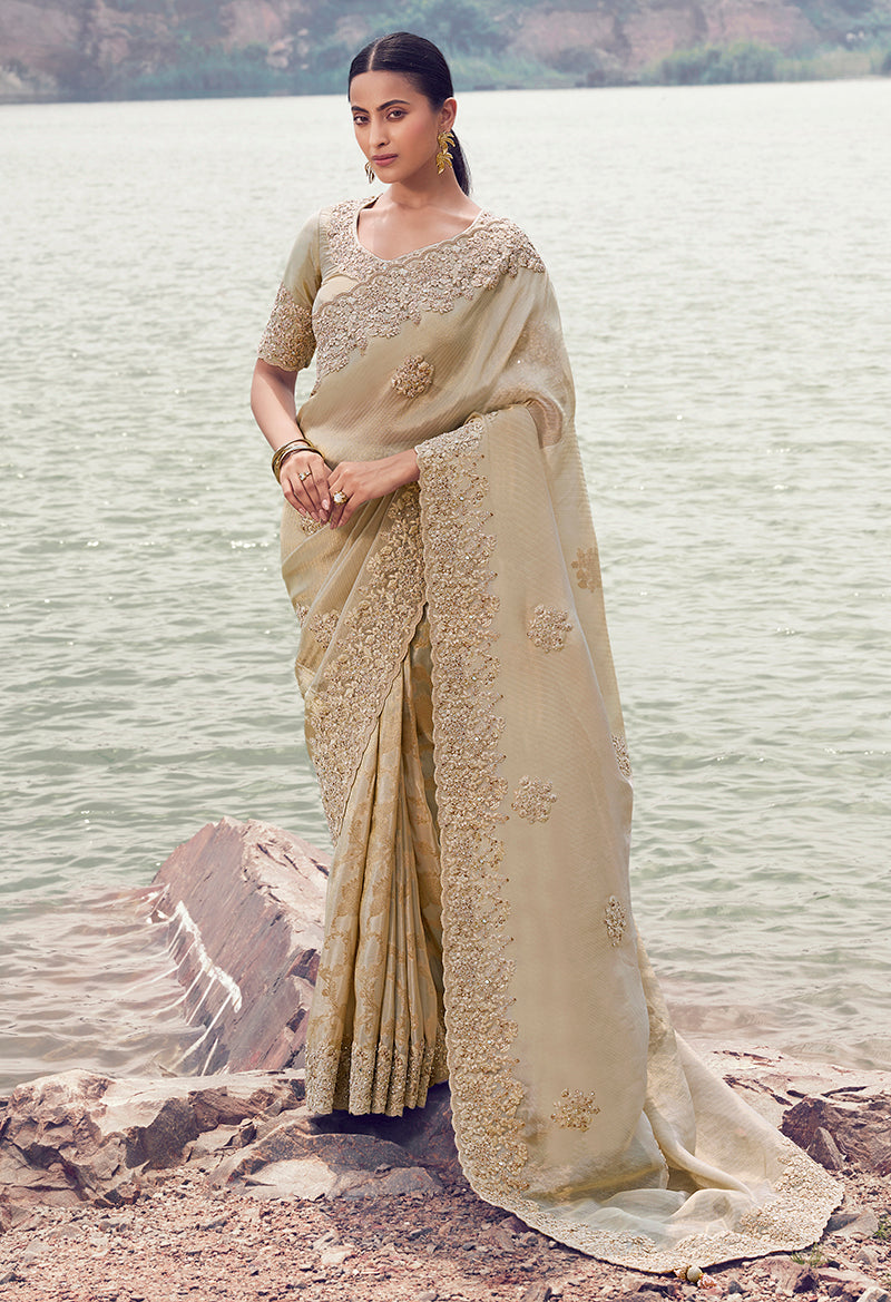 Beige faux tissue silk saree with intricate embroidery and khatli work