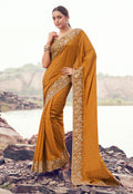 Rust orange satin silk saree with intricate embroidery and sequin embellishments