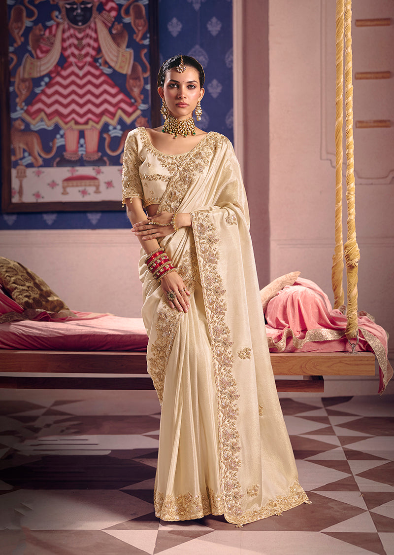 Elegant cream viscose zari tissue silk saree with intricate embroidery and golden sheen