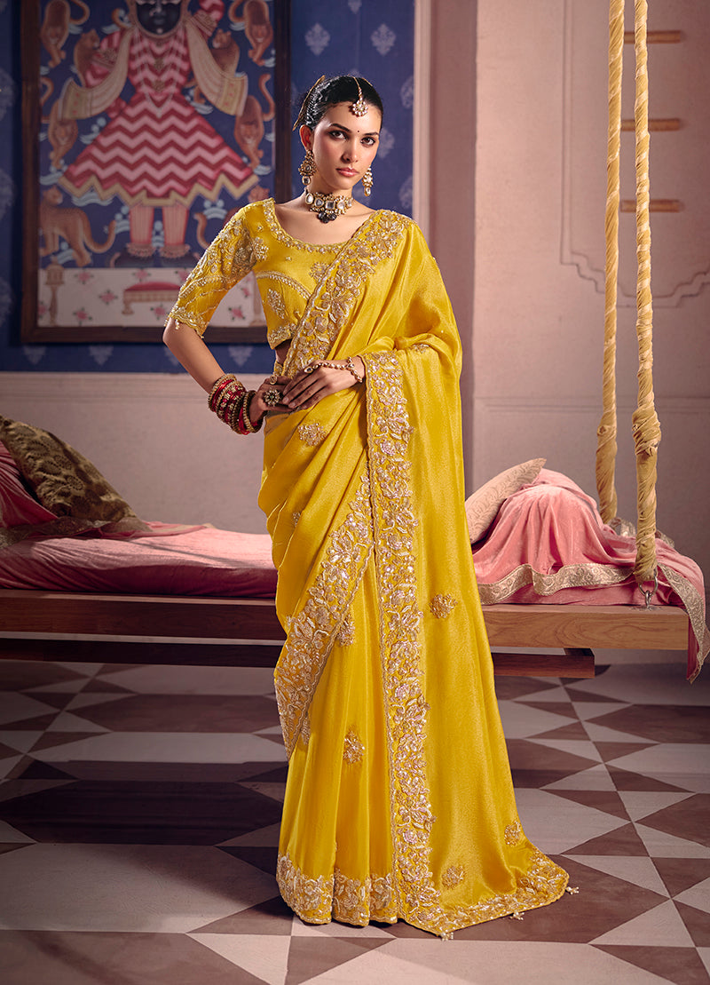 Yellow Viscose Zari Tissue Silk Saree with intricate embroidery work.