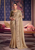 Chiku viscose zari tissue silk saree with intricate embroidery and a soft sheen.