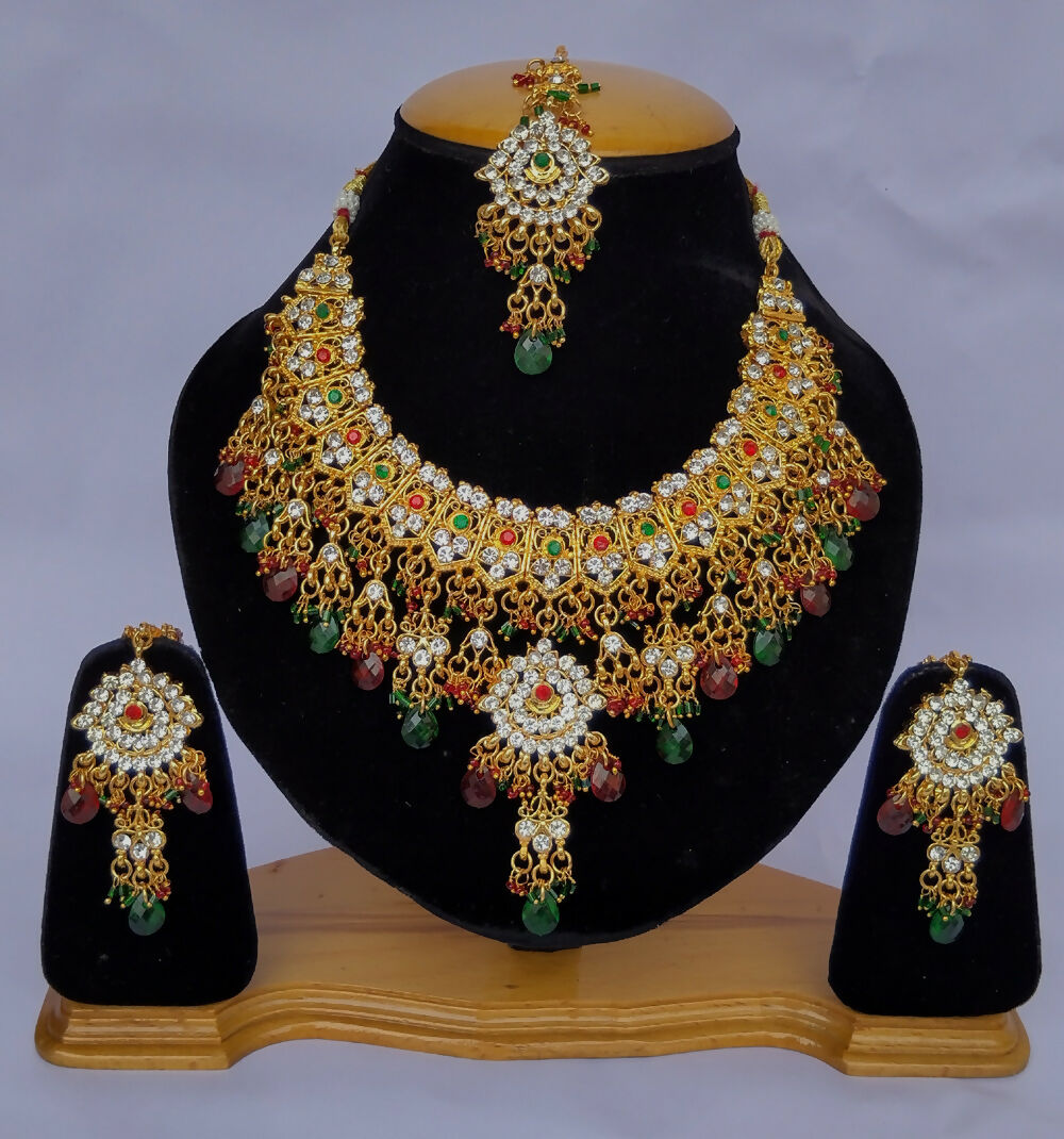 Gold plated Kundan stone studded necklace set with intricate handcrafted detailing