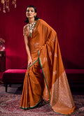Rust colored satin linen silk saree with handloom weaving patterns